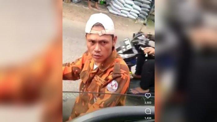 Pria Berseragam Oranye Palak Sopir Truk Di Bogor, Kini Diburu Polisi